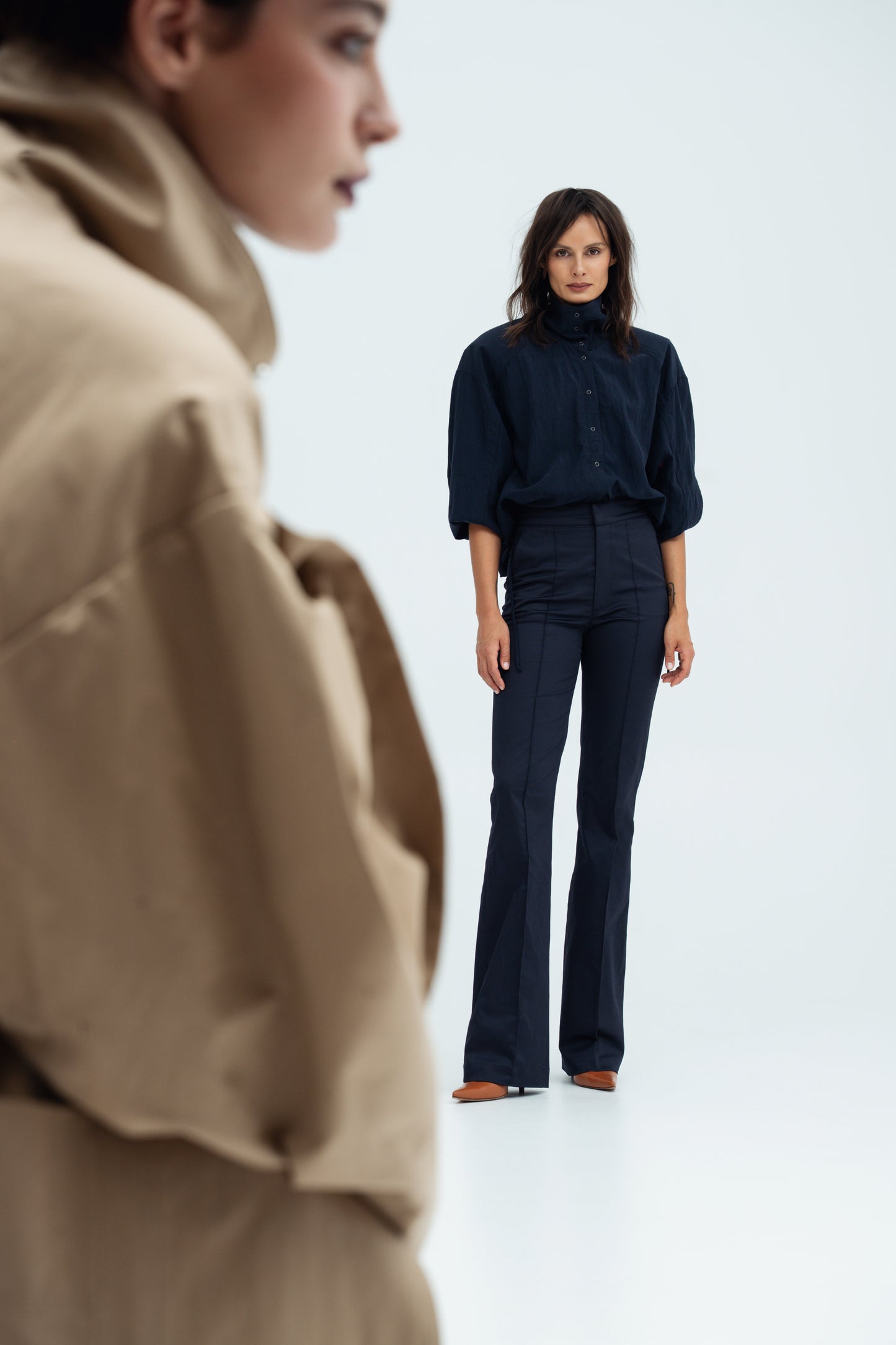 Model wears navy Enzy Pants from Resident Stranger.