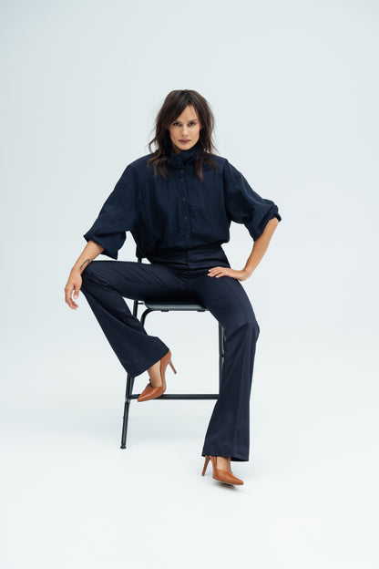 Model wears navy Enzy Pants  and Nume navy shirt by Resident Stranger.
